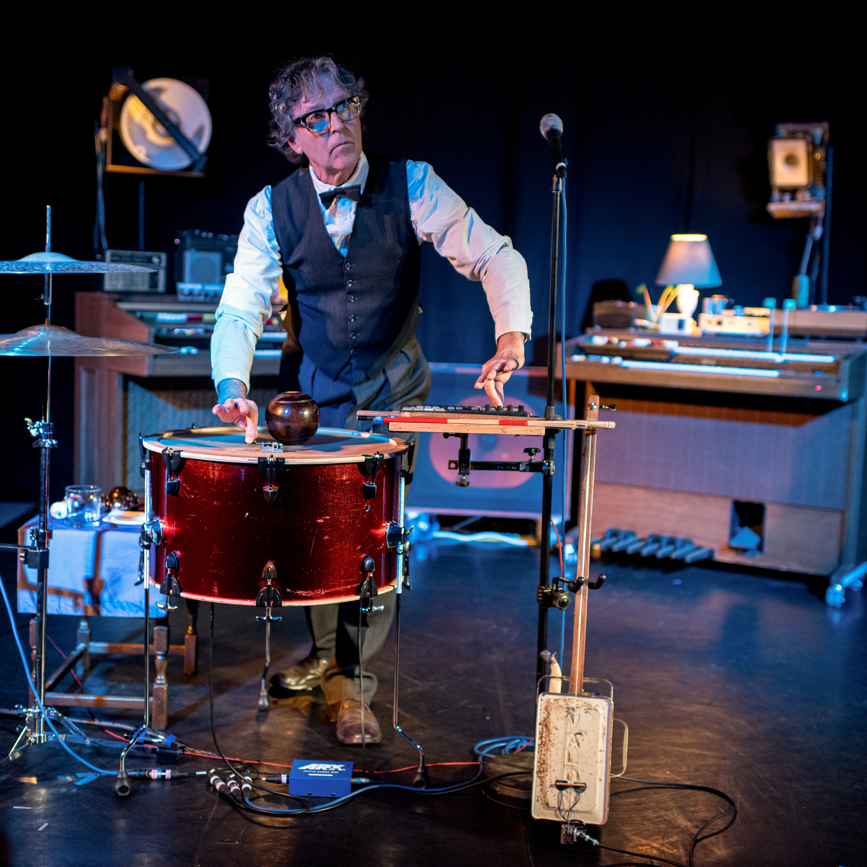 Musician playing drums and percussion on stage