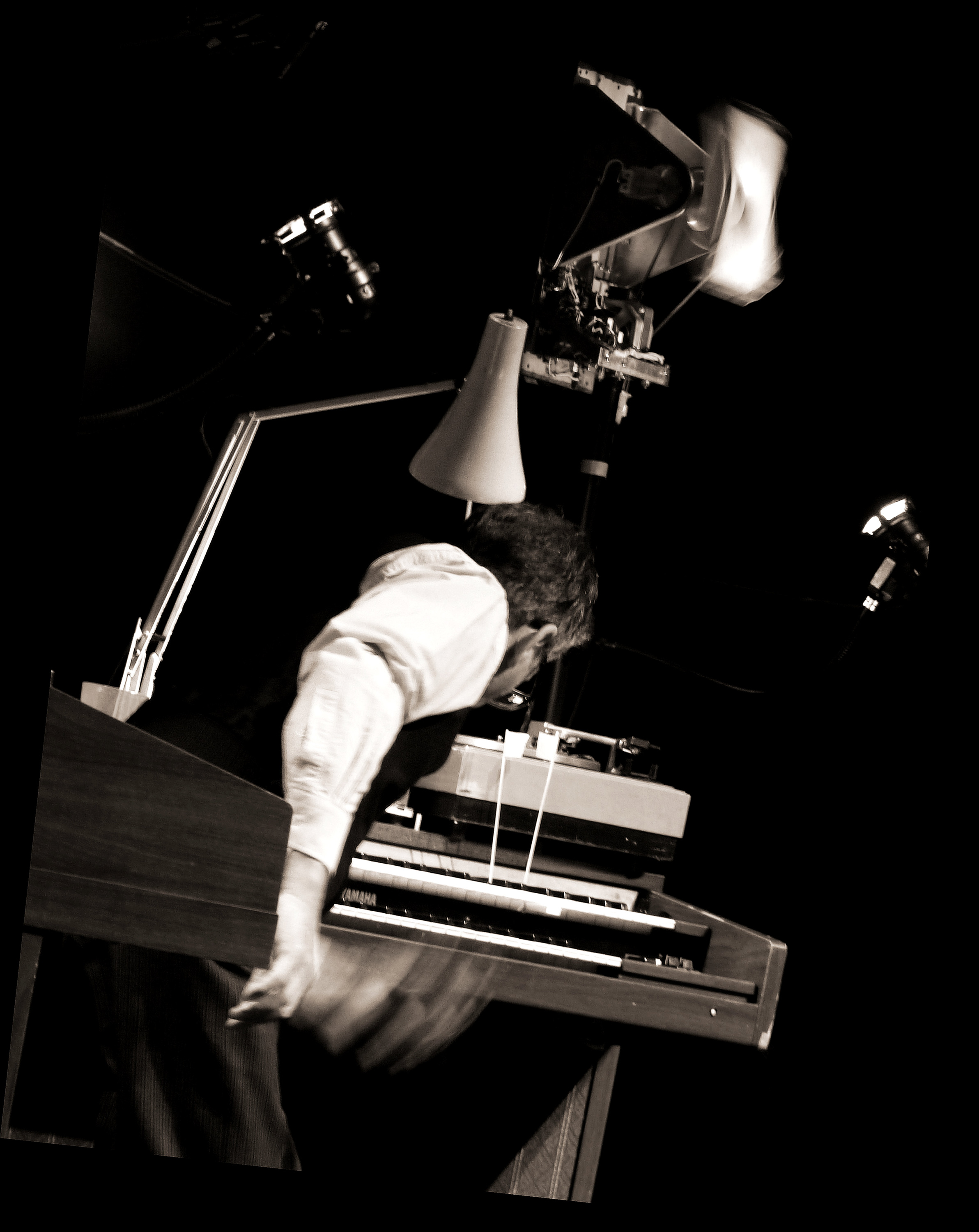 Performer playing organ in black and white